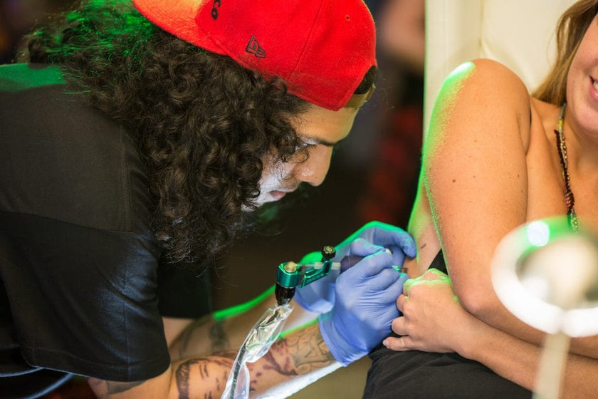 Tattoo Git tattoing at Hush Art Basel Pop Up