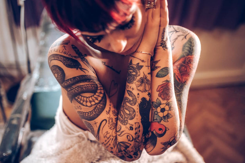 Classic Tattoos Down Both Arms a Woman